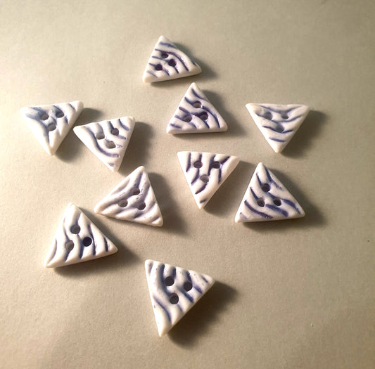 Triangular porcelain buttons.