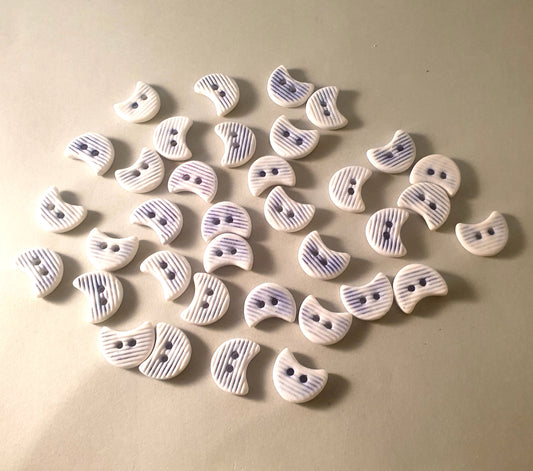 Porcelain half moon buttons.
